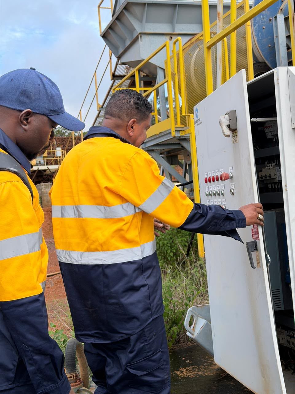 Field team working at a plant control panel